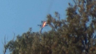 Hořící ruský Suchoj Su-24 Hořící ruský Suchoj Su-24